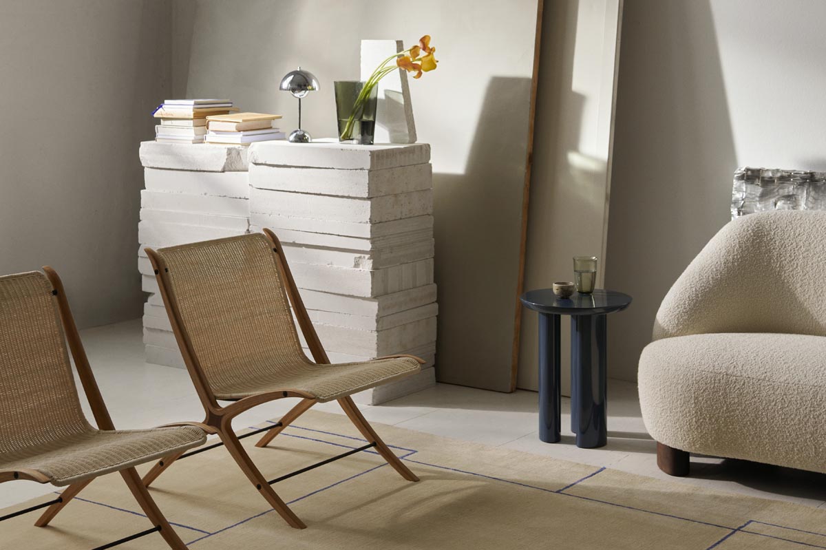 Minimalist living room with neutral decor, rattan mid-century modern chairs and beige bouclé sofa | Autumn-winter 2022 news from &Tradition | These Four Walls blog